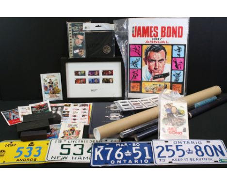 Group of James Bond related items, to include posters, keychains, Walt Howarth prints, paperback copy of From Russia With Lov