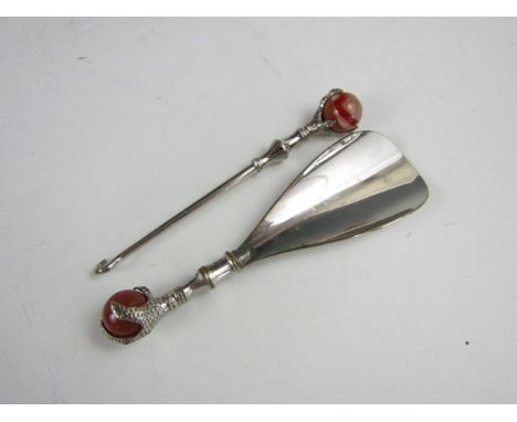 A late 19th Century novelty button hook and shoe horn set, with claw and ball terminals