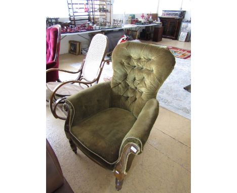 A Victorian button upholstered walnut armchair