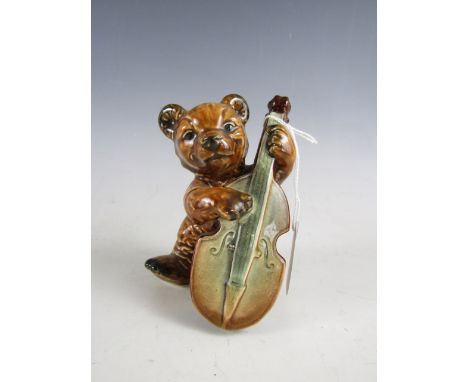 A Goebel porcelain bear playing a double bass