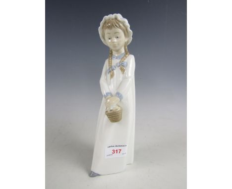 A Nao figurine of a young girl with holding a basket