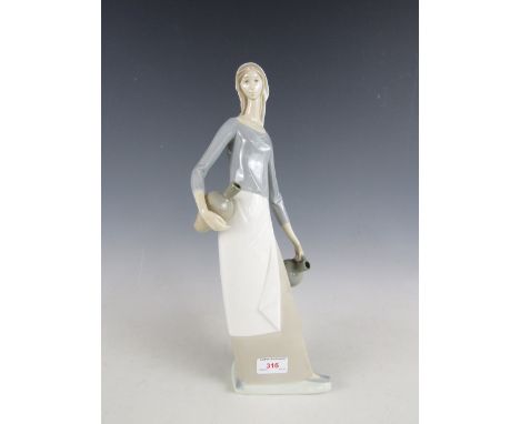 A Nao figurine of a woman with water pitchers