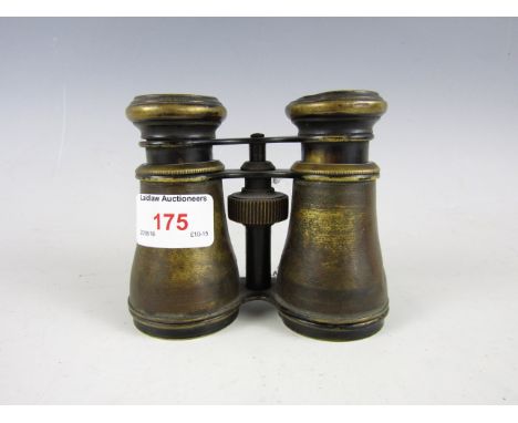 A pair of field glasses with integral compass