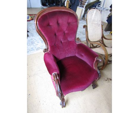 A Victorian button upholstered easy chair