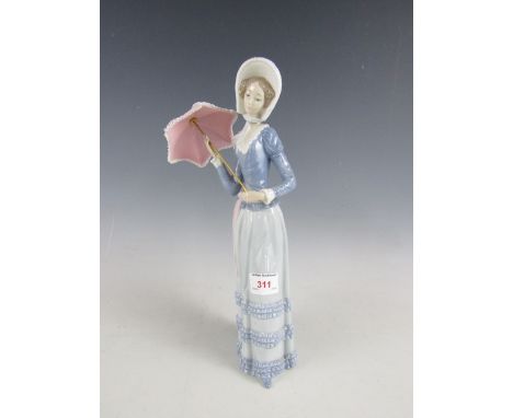 A Lladro figurine of a lady holding a parasol, 33 cm