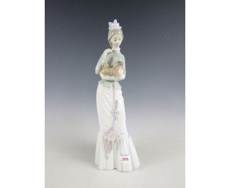 A Lladro figurine of a lady holding puppy, 38 cm