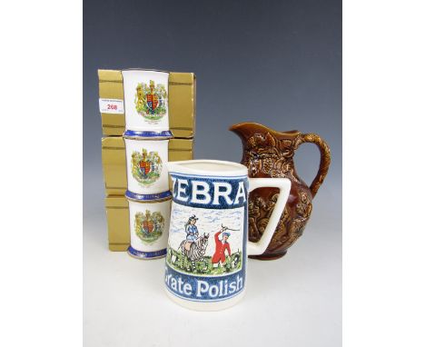 A Zebra Grate Polish water jug, together with one other and three Ringtons mugs