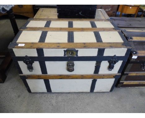 A late 19th Century steel strapped wooden trunk by Gooch and Fitzgerald of New York