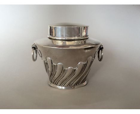 A Victorian silver tea caddy, of tapering oval section, with a pair of ring handles, and writhen decoration, London, 1897, 11