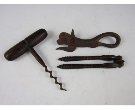 A 19th Century corkscrew together with a nut cracker and Bully Beef can opener