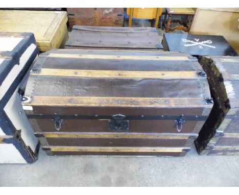 A late 19th Century domed top trunk