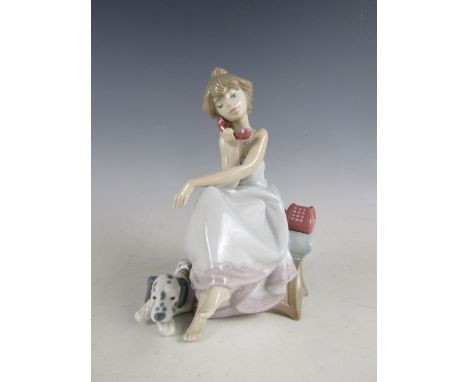 A Lladro figurine of a girl and a Dalmation dog