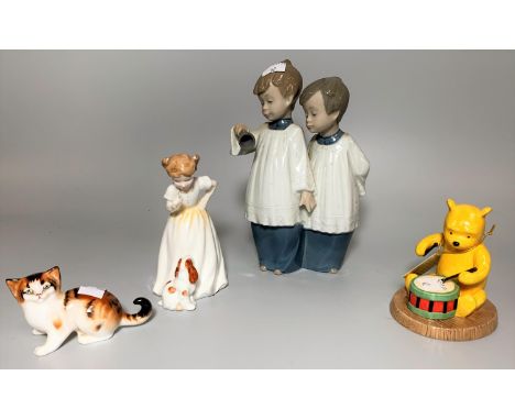 A Royal Doulton group "Sit" HN3123; a Royal Doulton "Winnie the Pooh", "Rum-tum-tum"; a Royal Doulton ginger Kitten &amp; a N