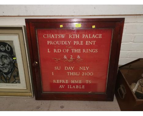 A Cinema Foyer programme board with box of letters and ratings figures 