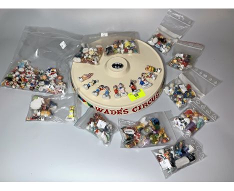 A Wades Circus ceramic stand &amp; a large collection of miniature Disney ceramic collectables from various films including A