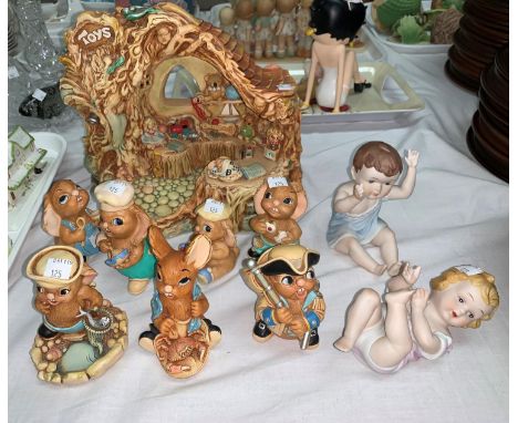 A Royal Crown Derby Ladybird two bisque piano baby, a collection of Swarovski and Pendelfin 