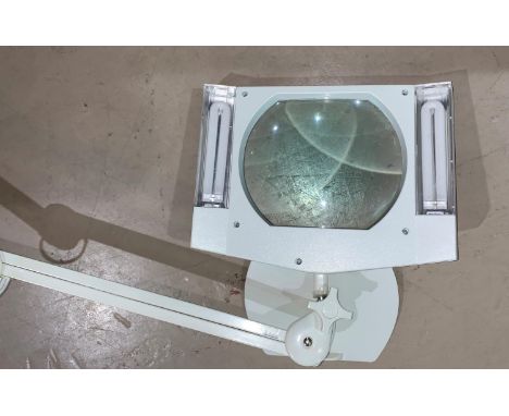 An angle poise type magnified collector's lamp 