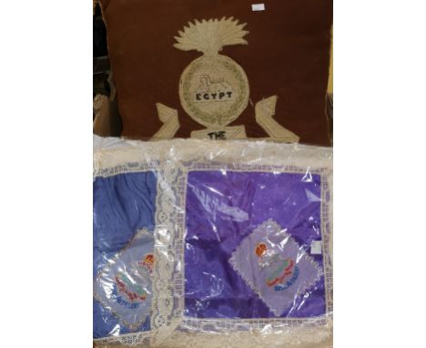 Two Royal Artillery French silk embroidered handkerchiefs, a cushion with embroidered Lancashire Fusiliers badge, a scrapbook