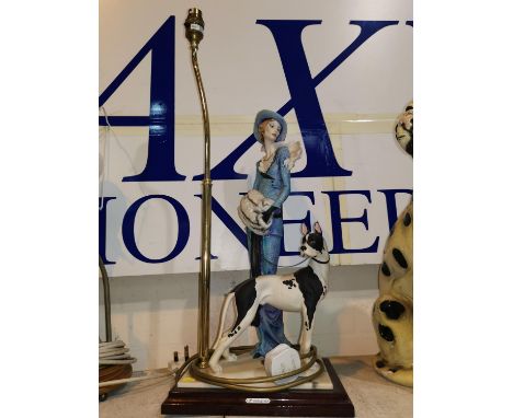 A large Art Deco style table lamp depicting a lady of fashion &amp; dog by Florence 