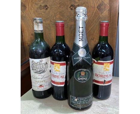 A bottle of 1977 Queens Silver Jubilee Moet &amp; Chandon Champagne and three vintage bottles of red wine 