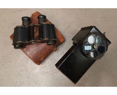 A British Admiralty signalling lantern pattern no 1038 and a pair of cased binoculars 