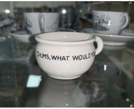 A miniature ceramic chamber pot cartoon of Hitler in the bottom, "Chums what would you do?" on the outside 