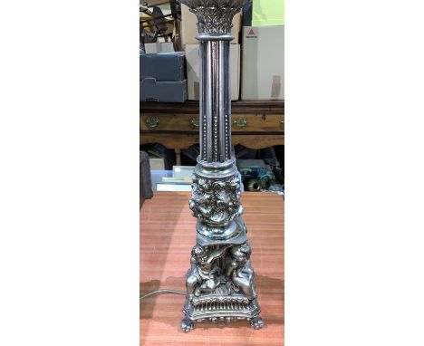 A large classical column table lamp in silvered metal with cherubs in relief height 22" 