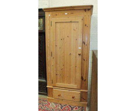 A modern pine single-door wardrobe on drawer base, 96cm wide.