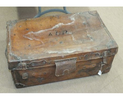 A vintage leather trunk inscribed "AOR" to the top, 76cm wide, 46cm deep, 33cm high.