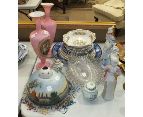 A pair of late-19th century Continental pink glass vases of baluster form with tapering neck and flared rim, each with oval p