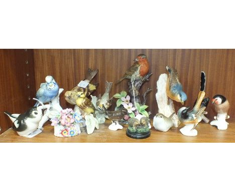 A collection of twelve Goebel and Lomonosov porcelain bird ornaments, (12).