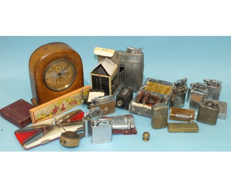 A Zenith bedside timepiece in leather case, a collection of cigarette lighters and miscellaneous items.