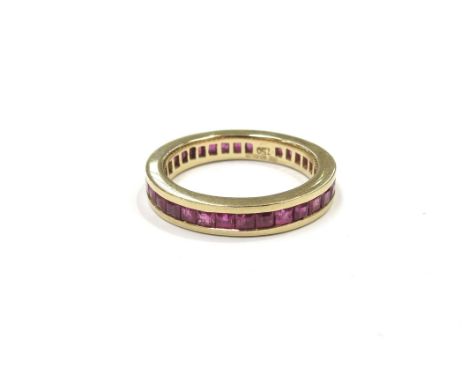 An 18ct gold ruby eternity ring. Size O, 4.8g