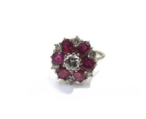 An 18ct white gold ruby and diamond cluster ring. Size L, 4.6g