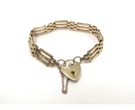 A 9ct gold three bar gate bracelet, 16cm long, 12.9g