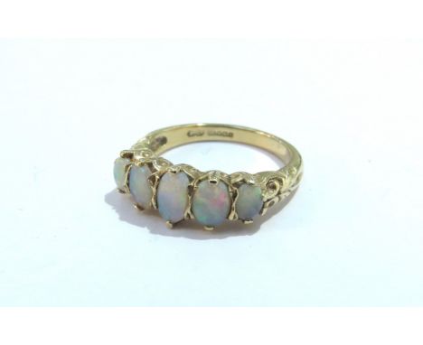 A 9ct gold graduated five stone opal ring. Size L/M, 3.1g