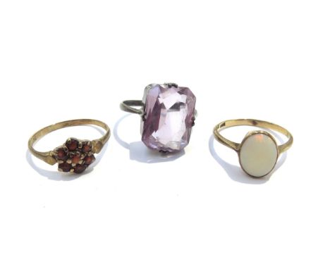 Two 9ct gold rings, opal and garnet cluster 3.2g and a 935 silver ring (3)