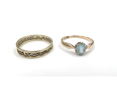 A 9ct gold pierced band. Size R and another ring stamped 585 set with an oval blue stone. Size Q, 3.6g
