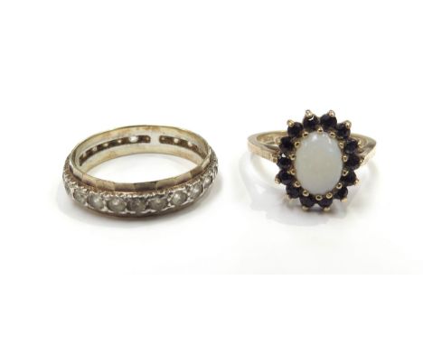 A 9ct gold opal and sapphire cluster ring, size M, 2.9g and a 9ct gold/silver band, size Q