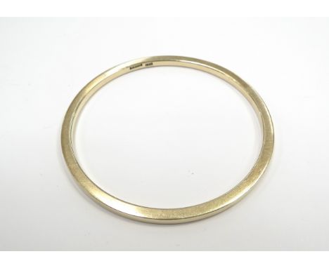 A 9ct gold bangle, 6.6cm diameter, 30g