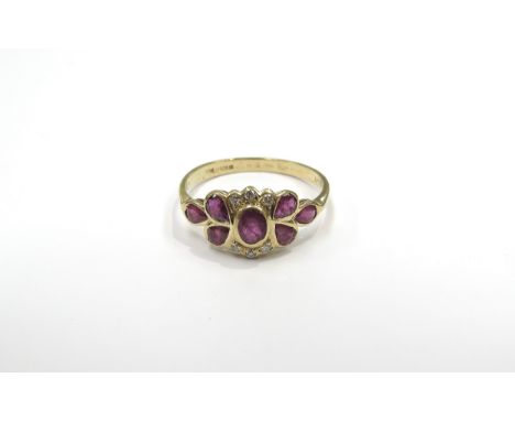 An 18ct gold ruby and diamond dress ring. Size P/Q, 2.3g