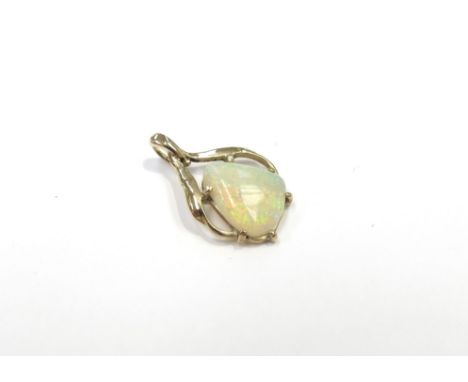 An irregular shaped opal pendant in gold mount stamped 14k, 1.3g
