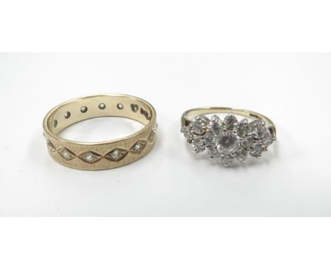 A 9ct gold eternity ring with clear stones and a 9ct gold cubic zirconia cluster ring, sizes R/S and K, 5.3g