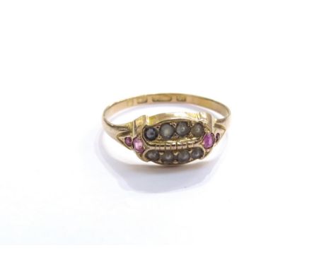 A late 19th Century 15ct gold ruby and seed pearl ring. Size Q/R, 1.8g