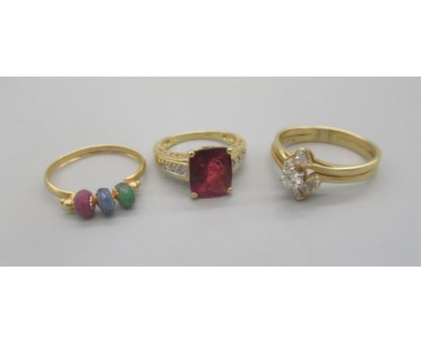 14ct yellow gold ring set with large red stone on diamond set shoulders, size L1/2, a 14ct yellow gold ring set with diamonds