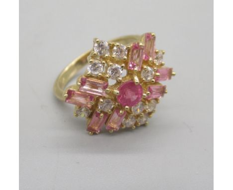 10ct yellow gold cluster ring, the central pink sapphire surrounded by clear and light pink stones, stamped 10k, size N, 4.29