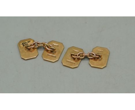 Pair of 9ct yellow gold rectangular faced cufflinks, each with one plain face and one face with engine turned detail, stamped