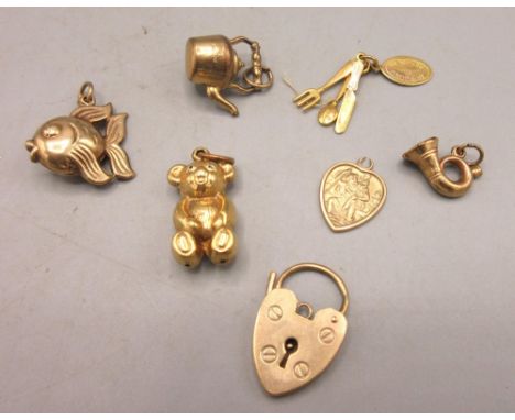 Collection of vintage and modern 9ct yellow gold charms including a fish, watering can etc. stamped 375, 10.49gShipping £23.0