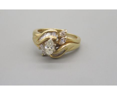 14ct yellow gold cluster ring with central marquise cut diamond, stamped 14k, size K1/2, 5.65gShipping £20.00 plus vat (UK On