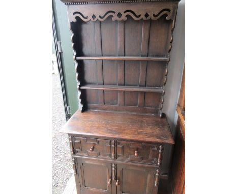 Oak cottage dresser, twin shelf back above two moulded drawers and two doors, on bracket feet. W90cm D45cm H185cmShipping POA